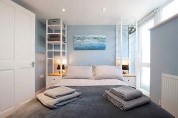 The ground floor double bedroom with access to the patio area...