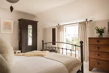 The main bedroom has views of the front lawn.