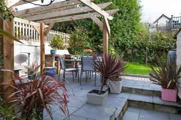 The patio has a built-in barbecue. The owners' garden is situated above, and the owners do enjoy using this area as they live next door.