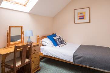 Bedroom 3 is another spacious room with twin beds. Pictured is bed number one.