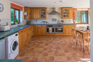 The kitchen is extremely spacious and well-equipped.