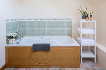 The bath in the family bathroom is perfect for relaxing and unwinding following a full day of adventure.