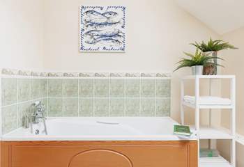 The bath in the family bathroom is perfect for relaxing and unwinding following a full day of adventure.