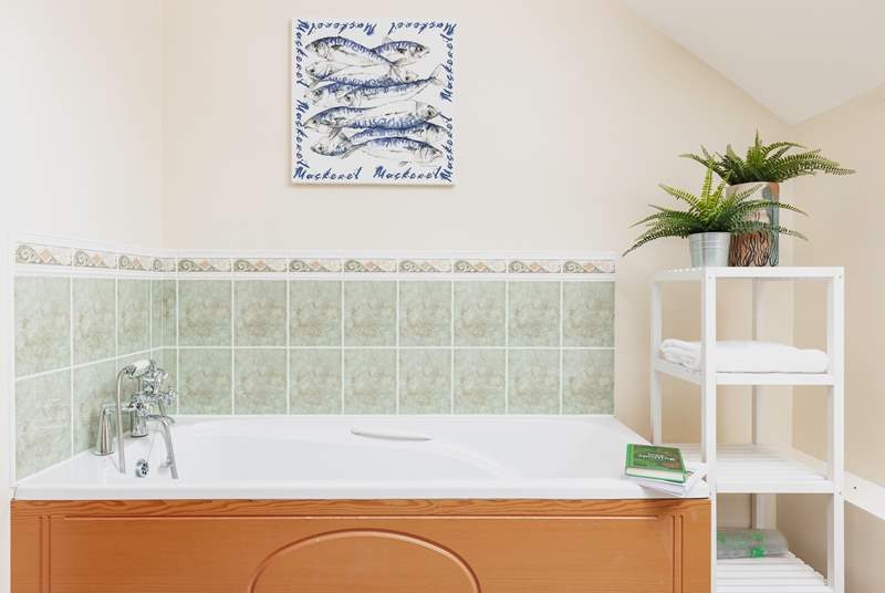 The bath in the family bathroom is perfect for relaxing and unwinding following a full day of adventure.
