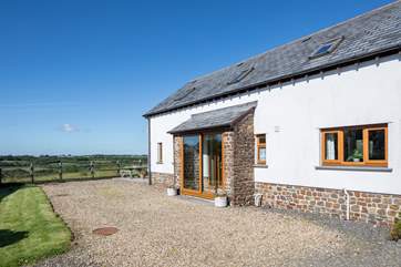 The outside space is vast and being fully enclosed it is perfect for both children and dogs alike.