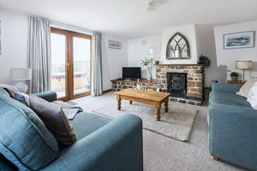 The sitting room also offers wonderful views of the surrounding countryside with patio doors leading out to the hot tub and garden.