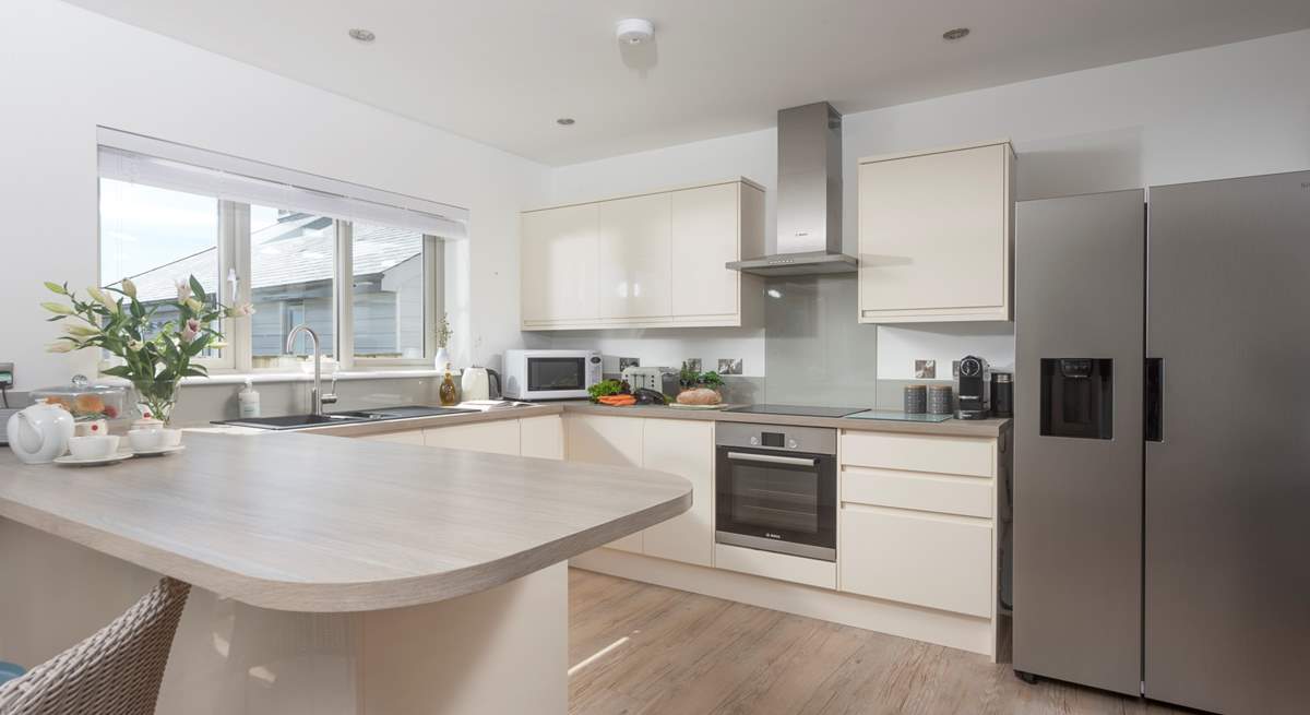 The modern well-equipped kitchen is a social space in the open plan living area to cook up a Cornish feast.