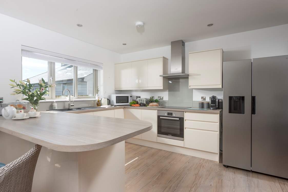 The modern well-equipped kitchen is a social space in the open plan living area to cook up a Cornish feast.