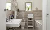 The luxurious bathroom with bath and power shower. - Thumbnail Image