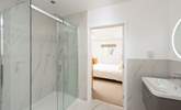 The beautiful en suite in bedroom 1 has stunning marble tiling. - Thumbnail Image