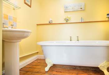The family bathroom has a stunning roll-top bath...