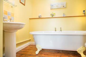 The family bathroom has a stunning roll top bath...
