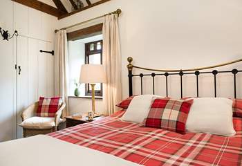 The bedroom has a gorgeous bedstead.