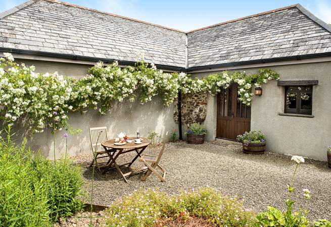 Welcome to Meadow Barn a gorgeous barn conversion for two with roses around the door.