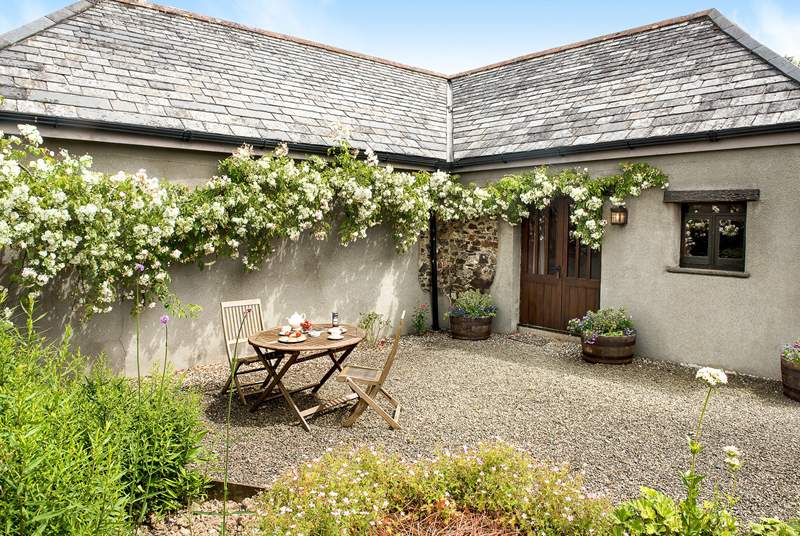 Welcome to Meadow Barn a gorgeous barn conversion for two with roses around the door.