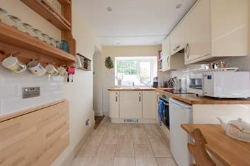 The well equipped kitchen and dining room.