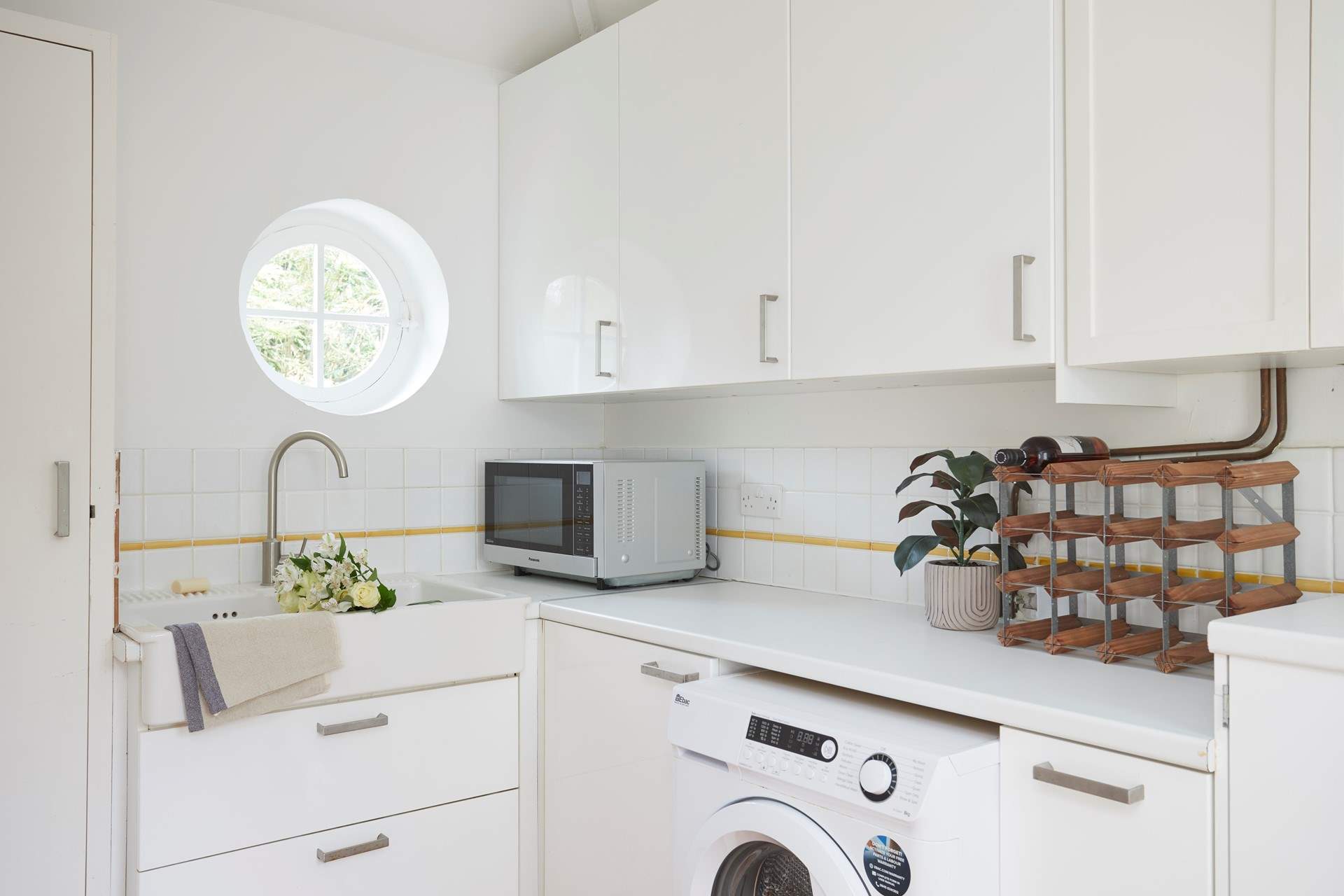 There is a handy utility room off the kitchen/dining room.