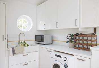 There is a handy utility room off the kitchen/dining room.