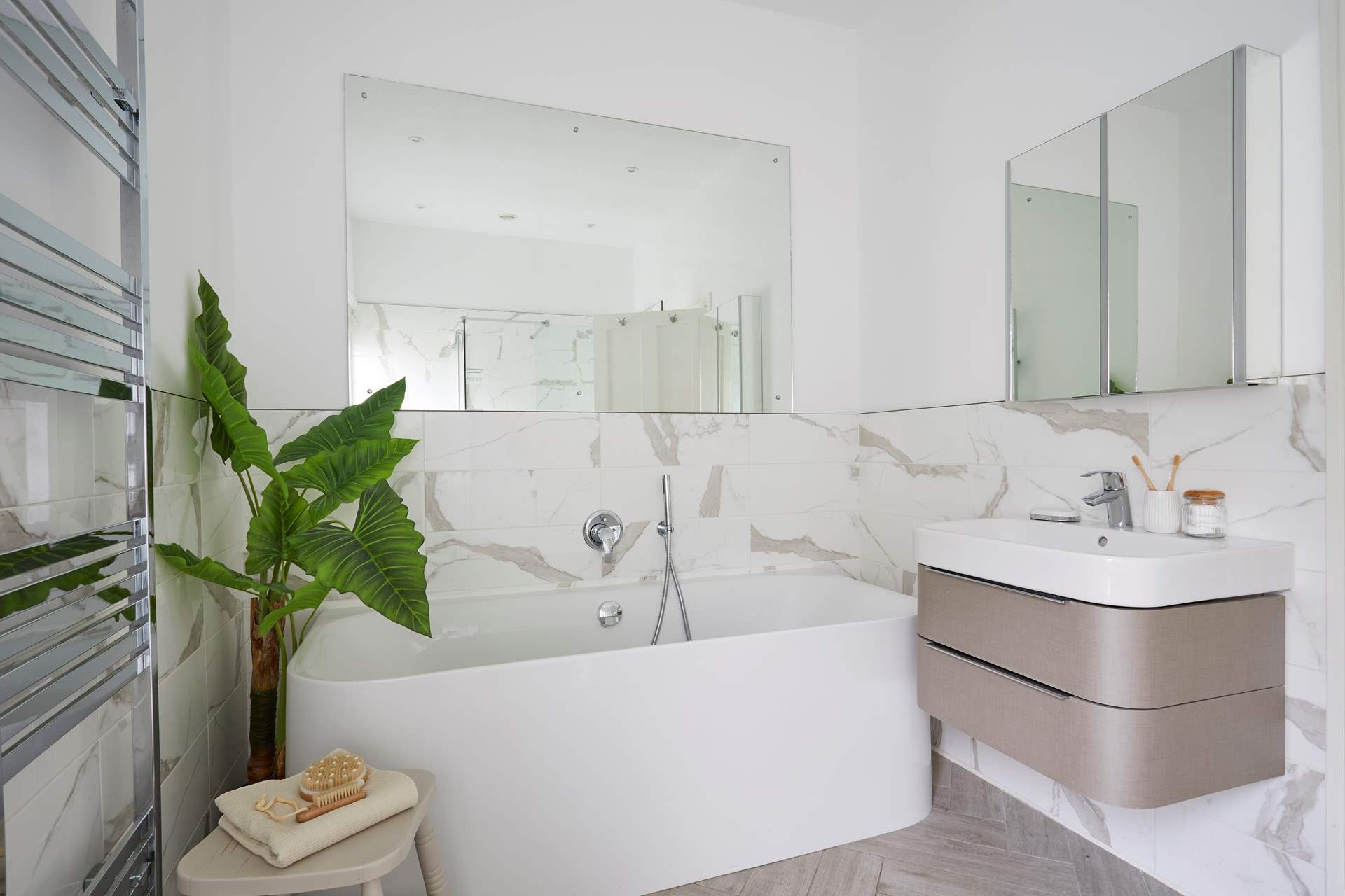 Lie back and relax in style in the family bathroom.