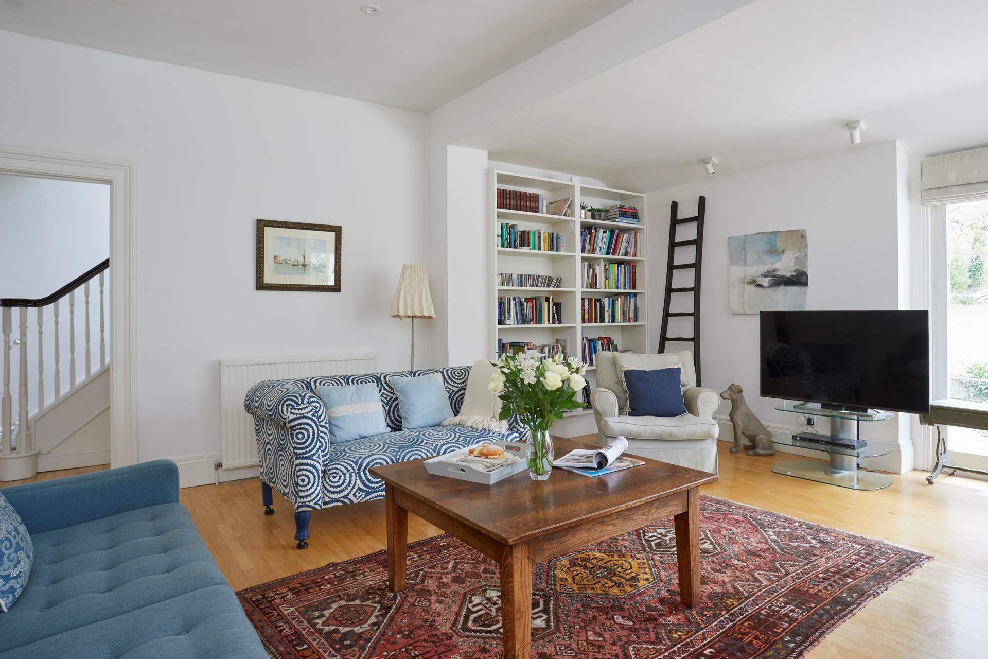 There is plenty of space and comfortable seating in the sitting-room.