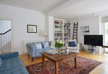 There is plenty of space and comfortable seating in the sitting-room.