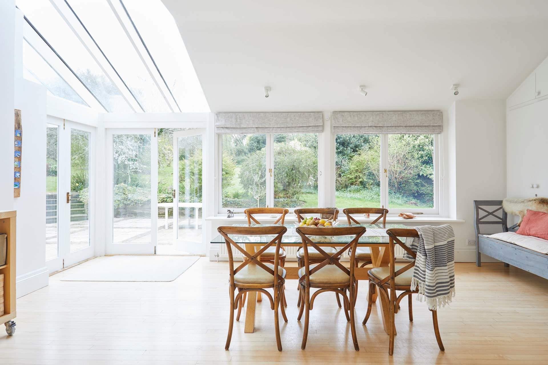 There is a lovely large dining-table with views of the garden for all to enjoy mealtimes together.