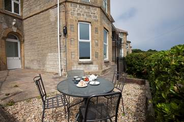 The terrace wraps around two sides of the property, the perfect spot to enjoy the evening sun