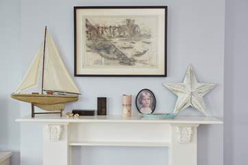 Precious items styled on the fireplace.