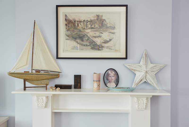 Precious items styled on the fireplace.