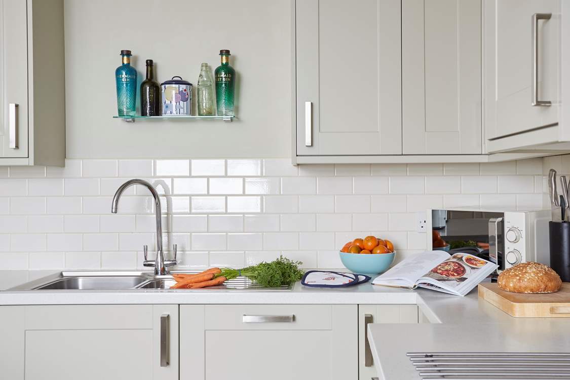 All the necessary kitchen items can be found to prepare a meal.