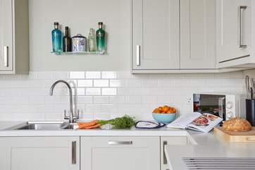 All the necessary kitchen items can be found to prepare a meal.