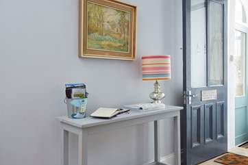 The light and airy entrance hall with guest book and bucket of leaflets with all the wonderful places to visit while on holiday.