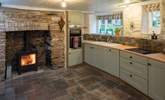 Even the kitchen has a top of the range wood-burning stove. - Thumbnail Image