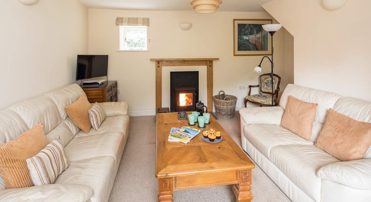 The comfortable sitting-room also has a wood-burner, which is perfect for those cosy nights in.