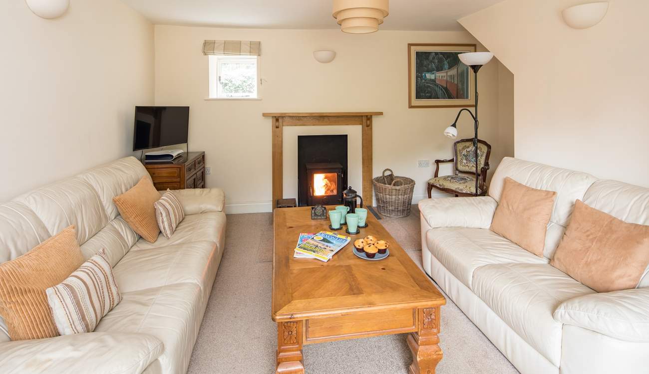 The comfortable sitting-room also has a wood-burner, which is perfect for those cosy nights in.