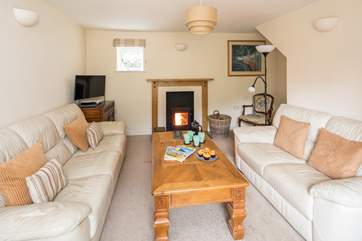 The comfortable sitting-room also has a wood-burner, which is perfect for those cosy nights in.