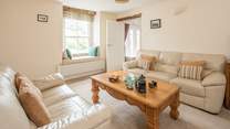 The sitting-room leads through to bedroom 1 and the ground floor shower-room.