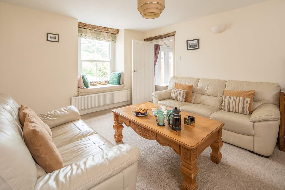 The sitting-room leads through to bedroom 1 and the ground floor shower-room.