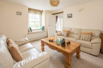 The sitting-room leads through to bedroom 1 and the ground floor shower-room.