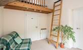 Bedroom 1 is on a raised platform. This single bed is the perfect retreat for that member of the party seeking total peace. Through the white door is the ground floor shower-room. - Thumbnail Image