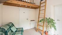 Bedroom 1 is on a raised platform. This single bed is the perfect retreat for that member of the party seeking total peace. Through the white door is the ground floor shower-room.