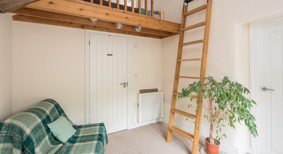 Bedroom 1 is on a raised platform. This single bed is the perfect retreat for that member of the party seeking total peace. Through the white door is the ground floor shower-room.