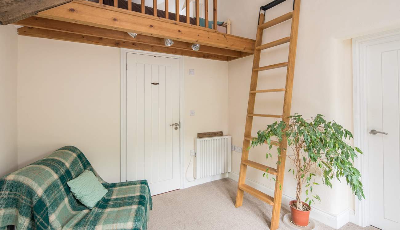 Bedroom 1 is on a raised platform. This single bed is the perfect retreat for that member of the party seeking total peace. Through the white door is the ground floor shower-room.