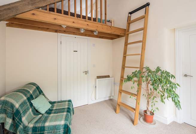 Bedroom 1 is on a raised platform. This single bed is the perfect retreat for that member of the party seeking total peace. Through the white door is the ground floor shower-room.