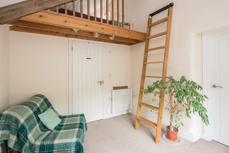Bedroom 1 is on a raised platform. This single bed is the perfect retreat for that member of the party seeking total peace. Through the white door is the ground floor shower-room.