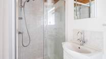 Ground floor shower-room with shower cubicle, WC and wash-basin.