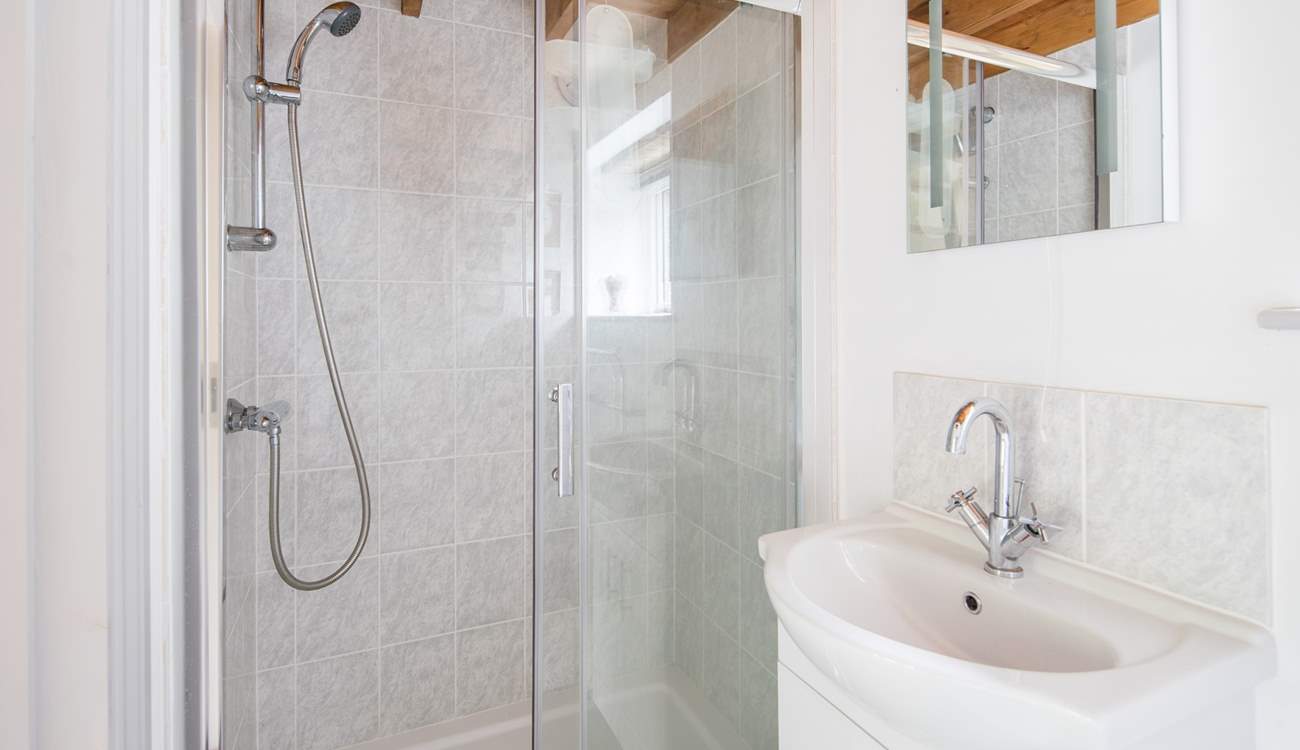 Ground floor shower-room with shower cubicle, WC and wash-basin.