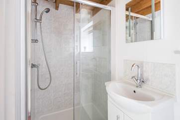 Ground floor shower-room with shower cubicle, WC and wash-basin.