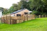 Bespoke built and overlooking the meadow (where you are welcome to roam with your four-legged friend) there is a huge wooden deck to enjoy too,