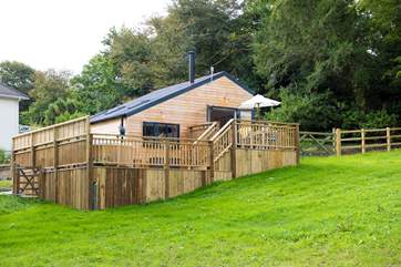 Bespoke built and overlooking the meadow (where you are welcome to roam with your four-legged friend) there is a huge wooden deck to enjoy too,